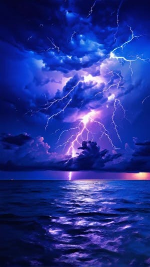 blue and purple lightning strike black sky over the ocean